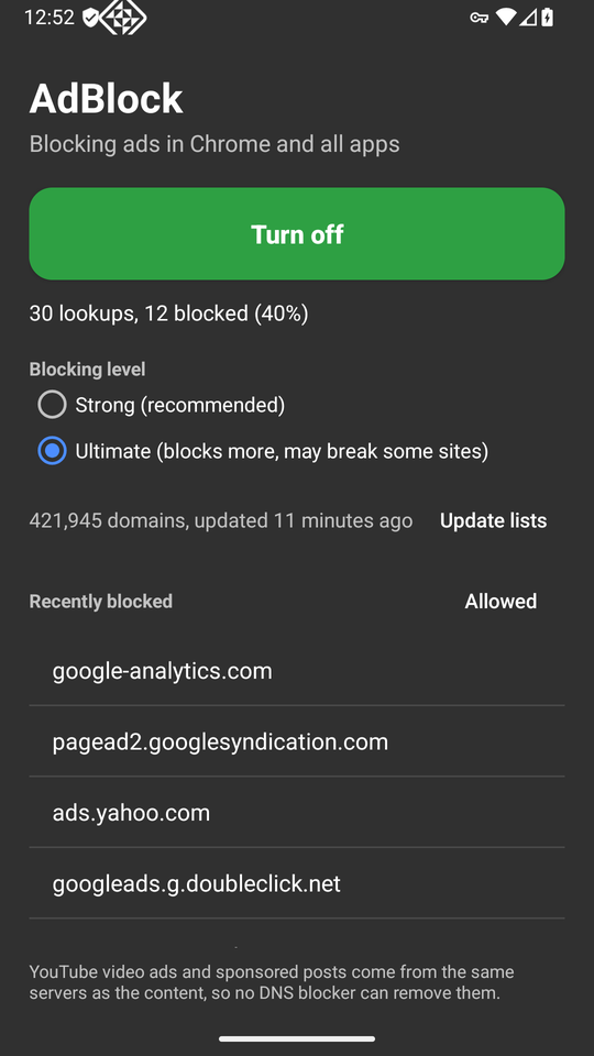 The AdBlock app in dark mode on the Ultimate level showing 421,945 domains, updated 11 minutes ago